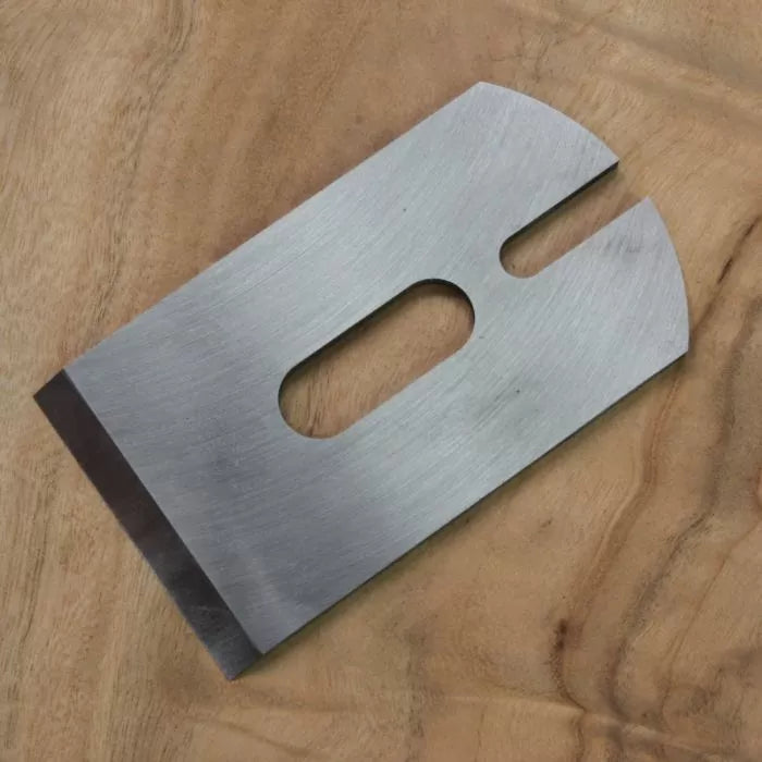 Replacement hand plane blade for woodworking shown on wooden surface