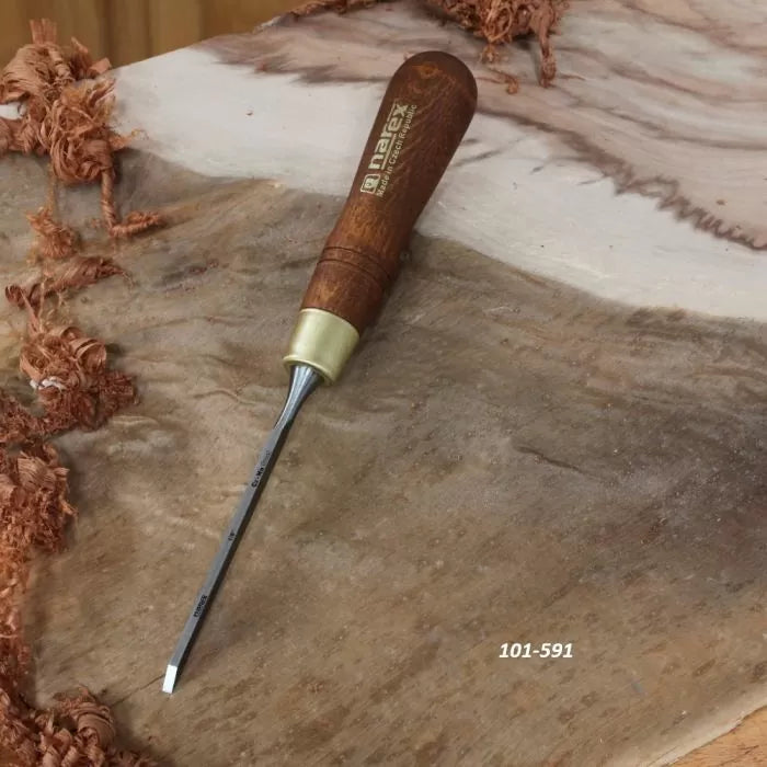 Woodworking chisel with wooden handle on a piece of carved wood, ideal for wood carving.