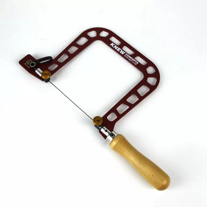 Jeweler's fret saw with a red metal frame and wooden handle, woodworking hand tool
