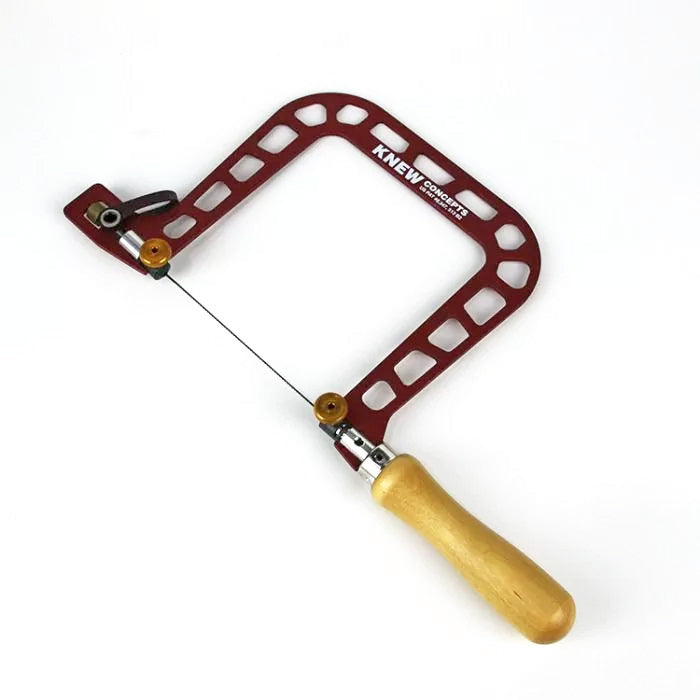 Precision woodworking coping saw with red steel frame and wooden handle on white background