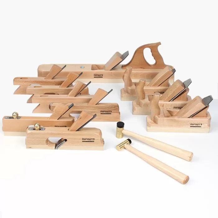 Woodworking chisel and hand plane tool set with mallets on white background