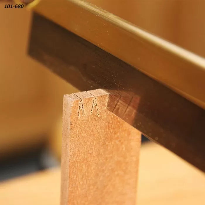 Fine woodworking saw making precise cut on wood for joinery or dovetail joints