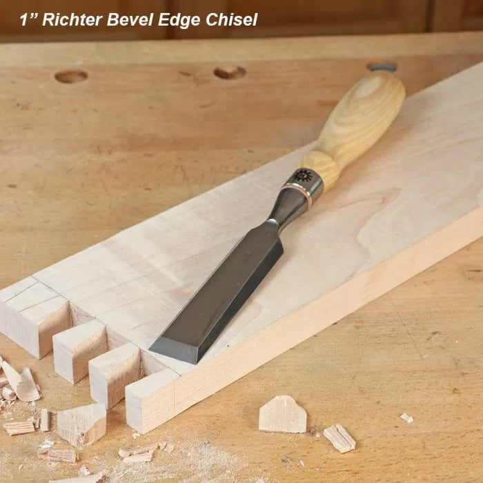 Bevel edge woodworking chisel with wooden handle on dovetail jointed board