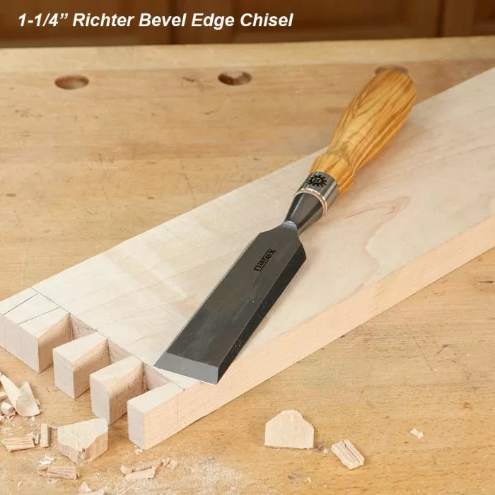 1-1/4 inch bevel edge chisel with wood handle on dovetailed woodworking board