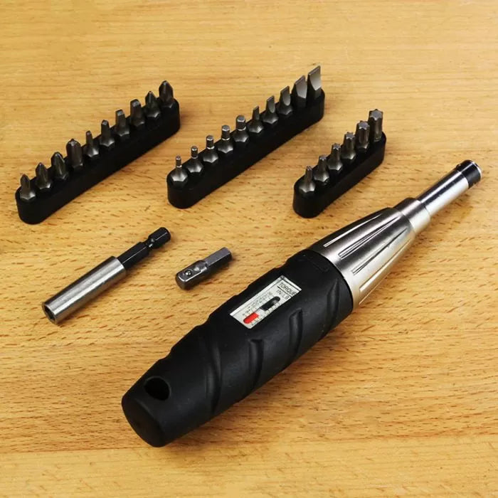Precision torque screwdriver set with assorted bits on a wooden surface