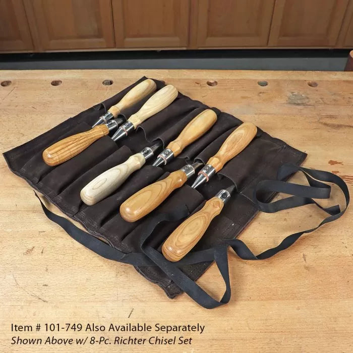 8-piece woodworking chisel set with wooden handles in a black tool roll on a workbench