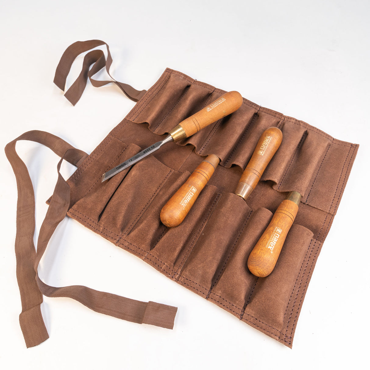 Woodworking chisels with wooden handles in a brown suede tool roll