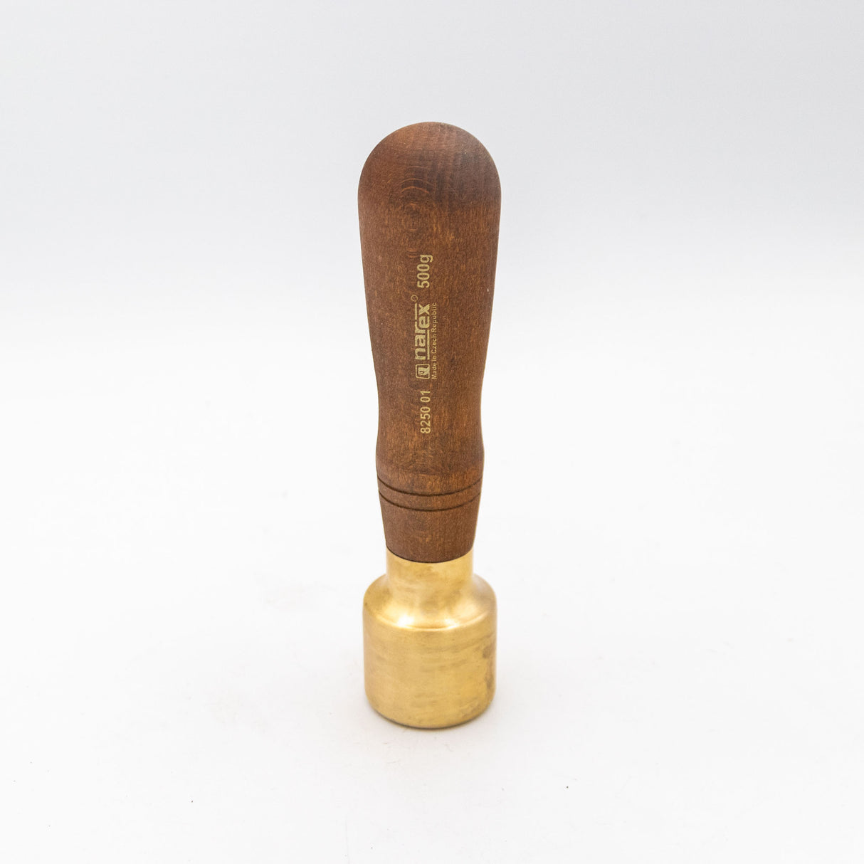 Brass woodworking mallet with a wooden handle on a white background