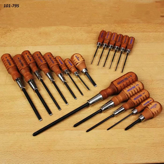 Wooden handle screwdriver set neatly arranged on a workbench for woodworking projects.