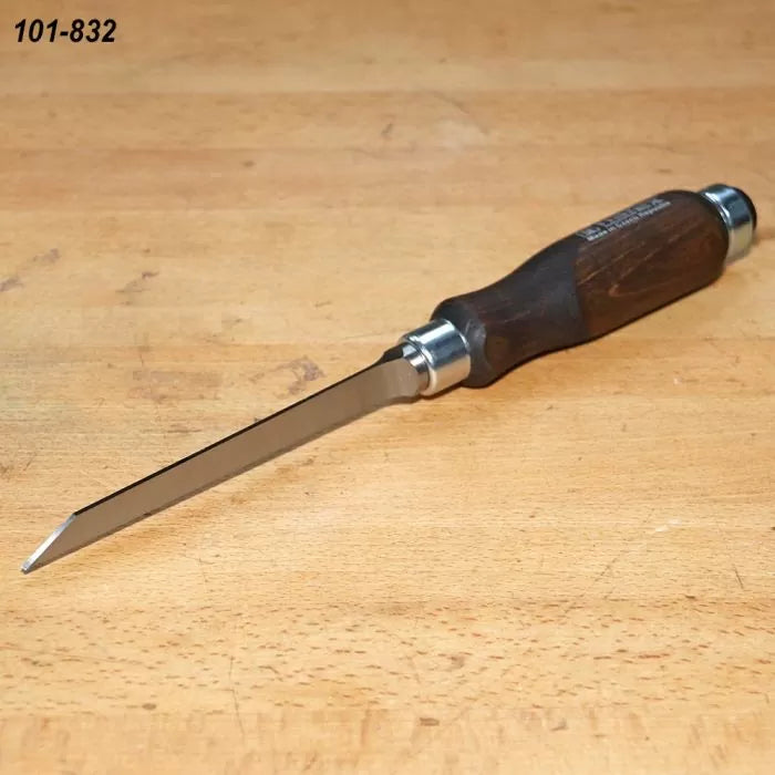 Woodworking marking knife with steel blade and dark wood handle on workbench