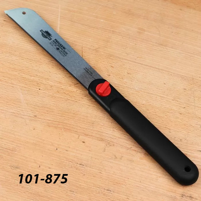Japanese pull saw with black handle and red knob on wooden surface, woodworking hand tool