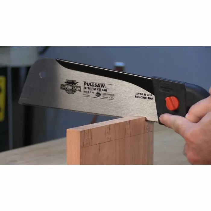 Pull saw making precise cuts in wood, woodworking hand tool, close-up action shot