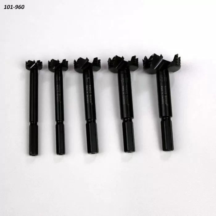 Set of five black Forstner drill bits for woodworking on white background