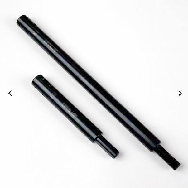 Two black steel router collet extension shafts for woodworking tools on white background