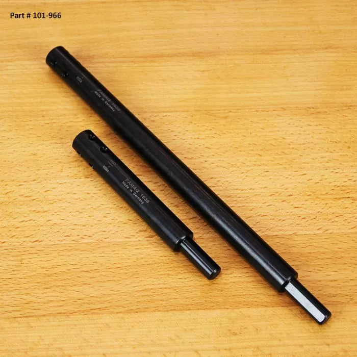 Two black steel woodworking tool extensions on a wood surface, part #101-966.