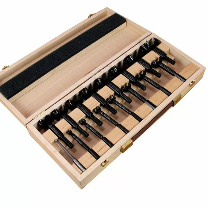 Wooden case with a set of Forstner drill bits organized for woodworking
