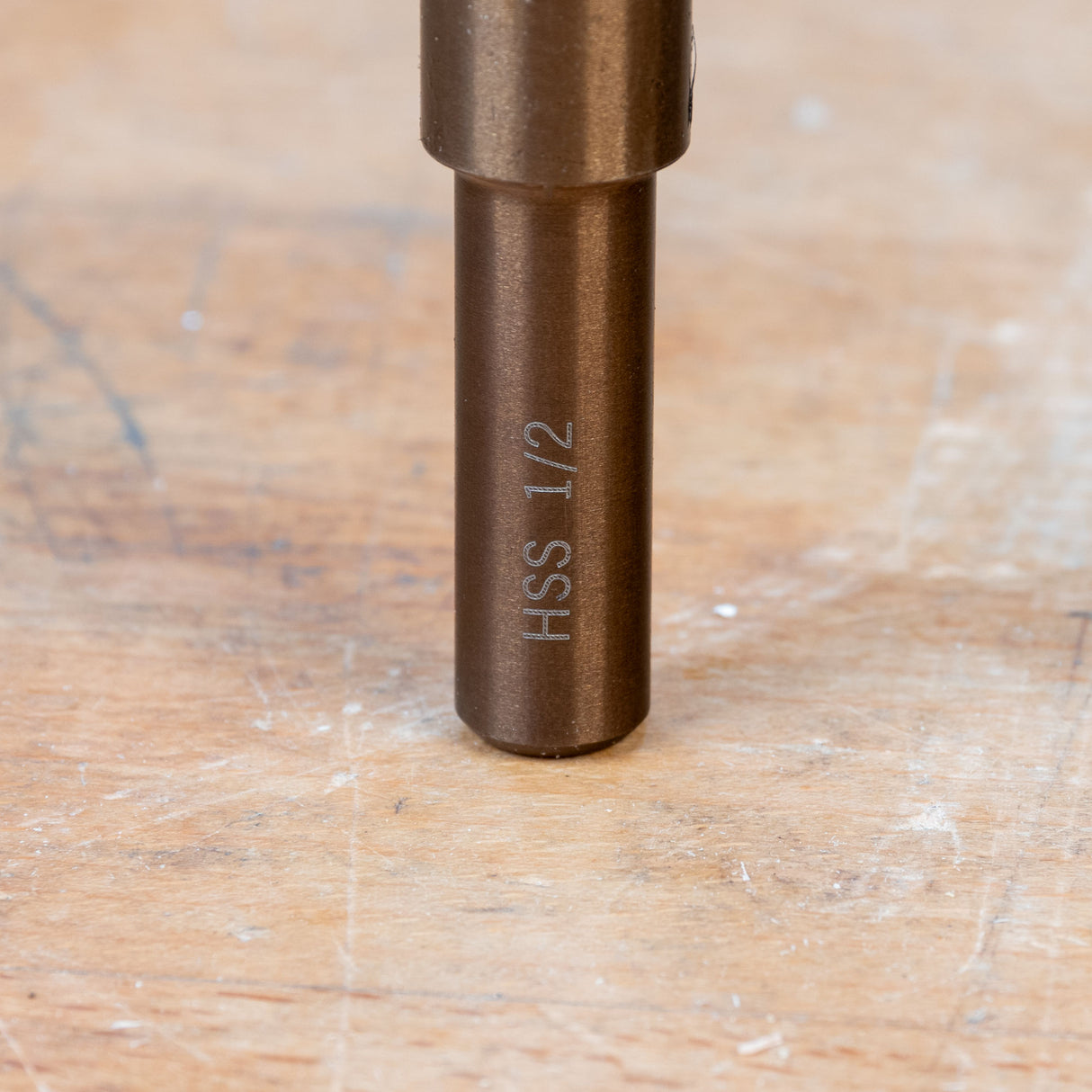 Closeup of HSS 1/2 marking on metal woodworking tool shank on a workbench