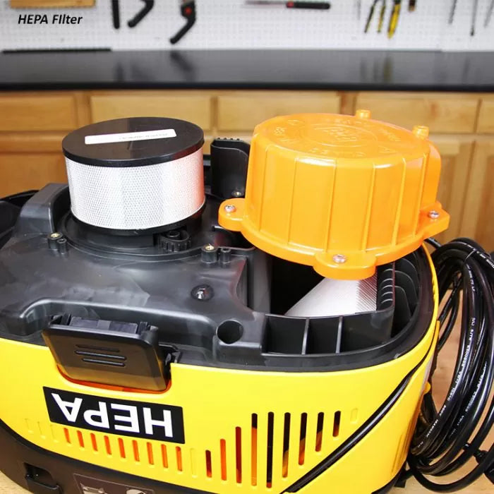 HEPA filter vacuum with exposed filter in a woodworking shop setting