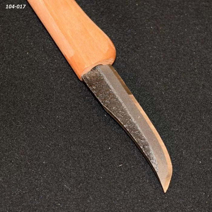 Woodworking carving knife with a curved steel blade and a wooden handle on black fabric