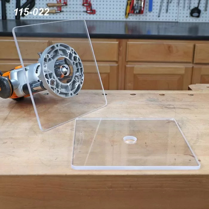 Clear acrylic router base plates on woodworking bench for router tool precision setup