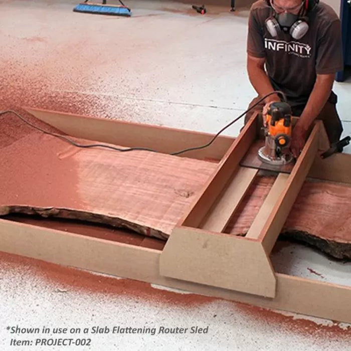 Woodworker using a slab flattening router sled on a large live edge wood slab