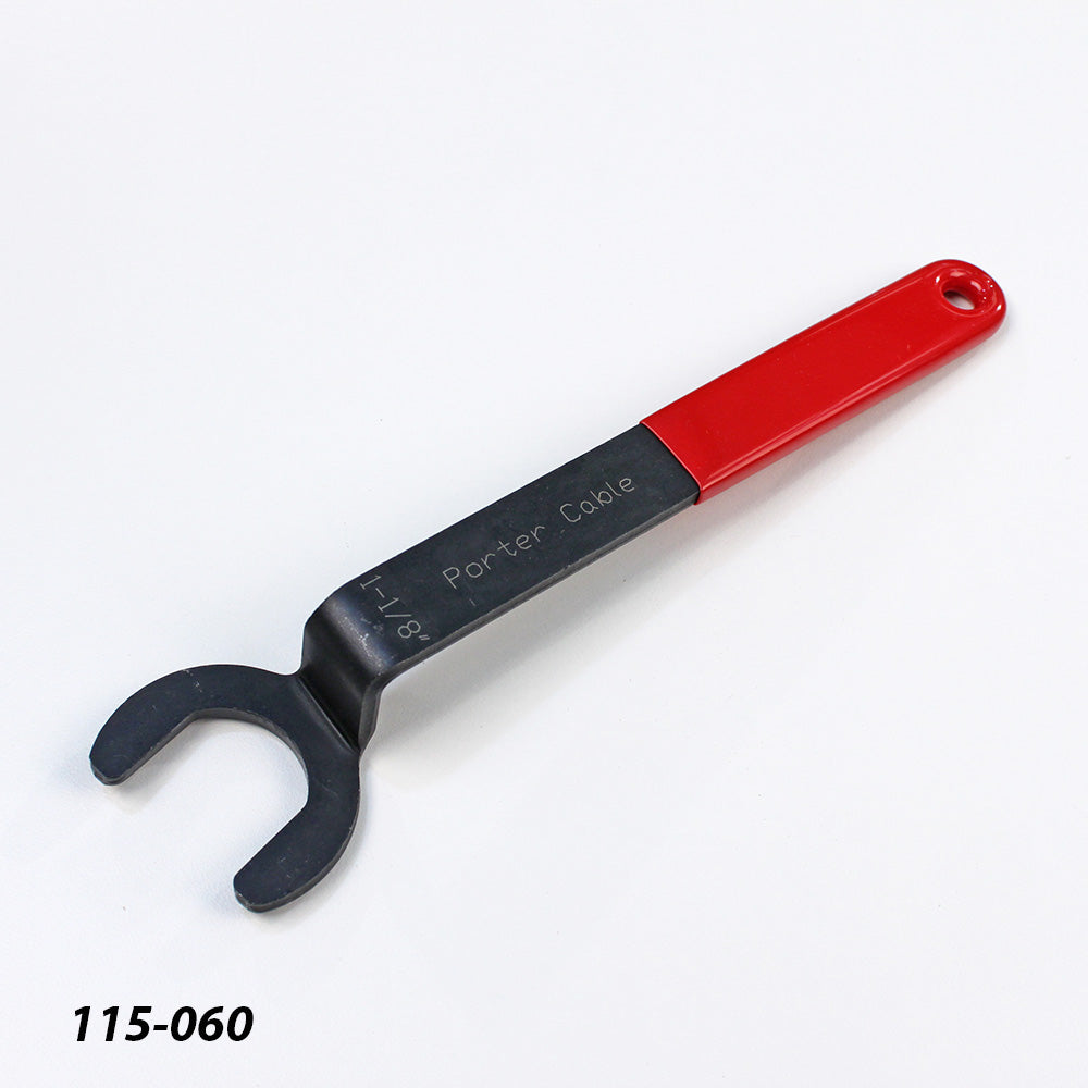 Open-end spanner wrench with red handle for woodworking tool adjustment on white background