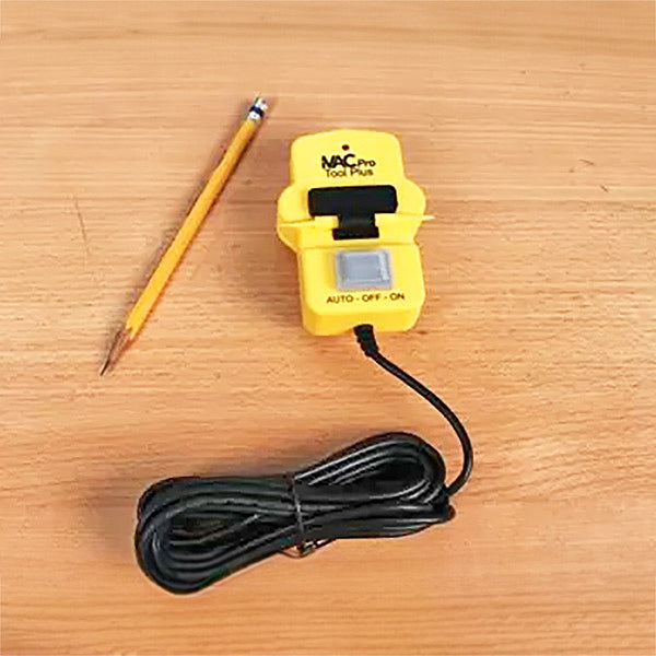 Yellow power tool switch with auto off on settings and long cord on wooden surface, pencil beside