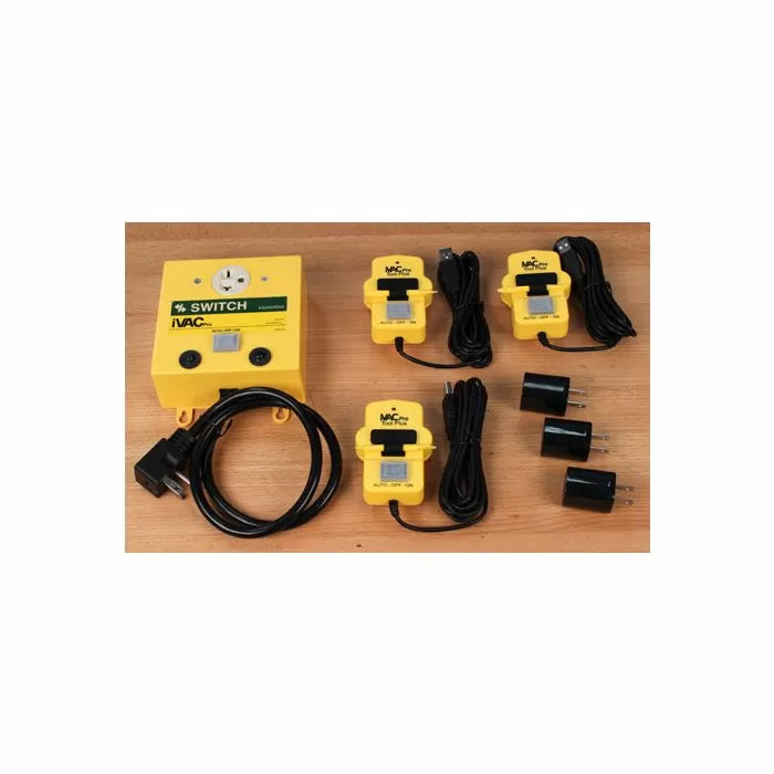Woodworking iVac switch kit with yellow power control unit and sensor modules on wood surface