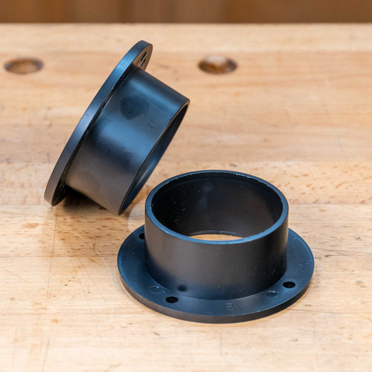 2-1/2 inch dust collector connector fittings on a wooden workbench