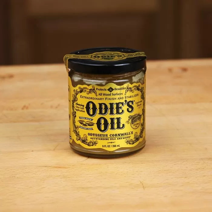 Odie's Oil wood finish jar on a wooden surface, woodworking finishing product