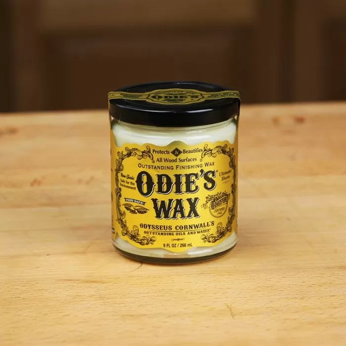 Odie's Wax wood finishing wax jar on a wooden surface, woodworking tool accessory