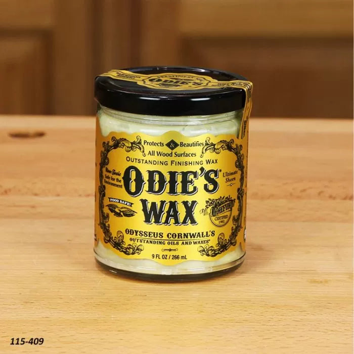Odie's Wax jar for wood finishing on a wooden table, woodworking supplies.