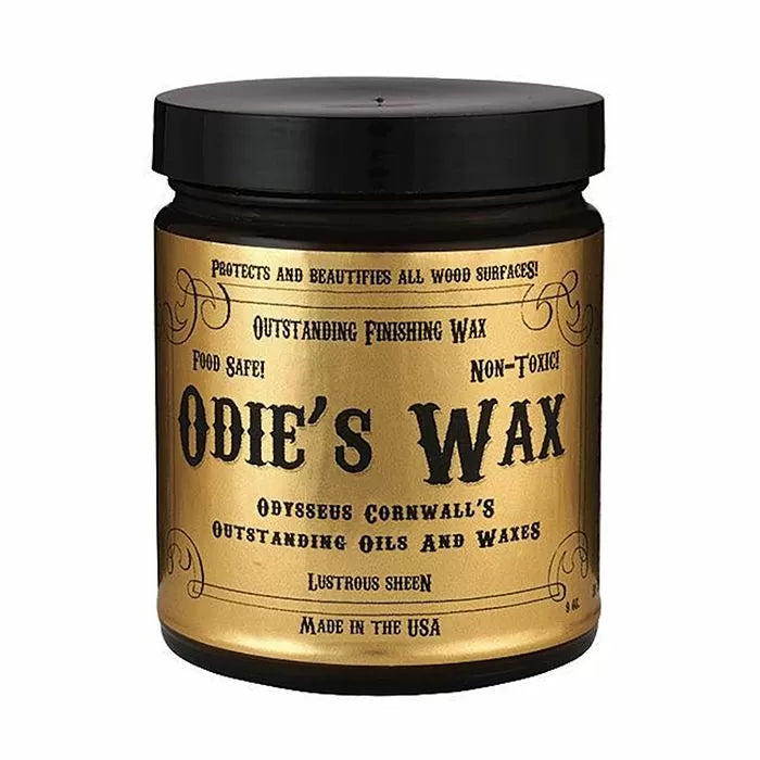 Odie's Wax wood finish in a gold and black jar for woodworking and furniture protection