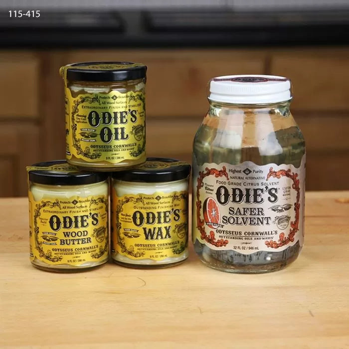 Odie's Oil, Wood Butter, Wax, and Safer Solvent jars for woodworking finishes on wood surface