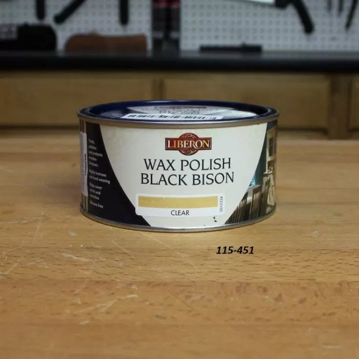 Liberon Wax Polish Black Bison Clear wood finish can on a woodworking bench
