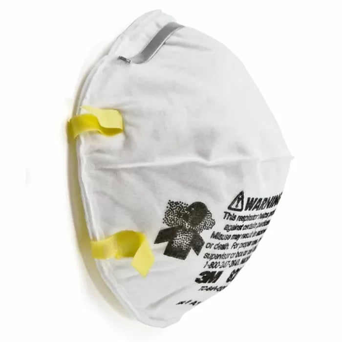 White dust mask with yellow straps and printed safety warning, woodworking respirator