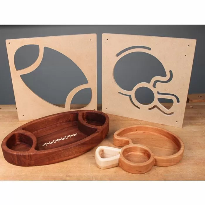 Woodworking templates and finished trays in football and helmet shapes on a workbench