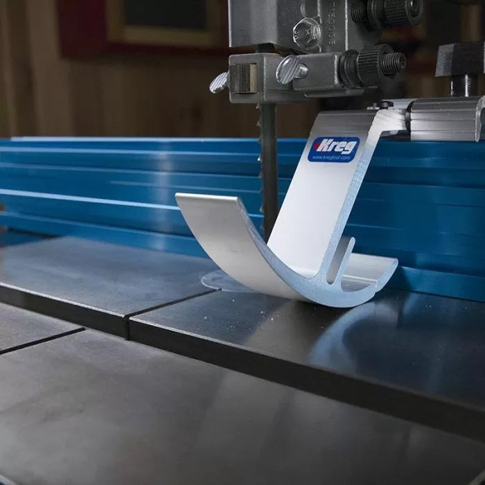 Bandsaw with blue aluminum fence and Kreg bandsaw guide for precise woodworking cuts