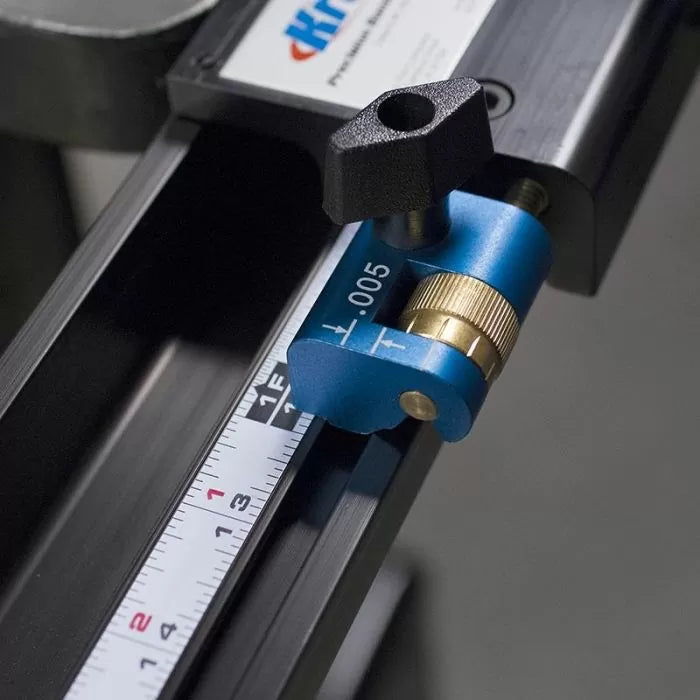 Precision woodworking fence stop with micro-adjuster on a measuring track for router table