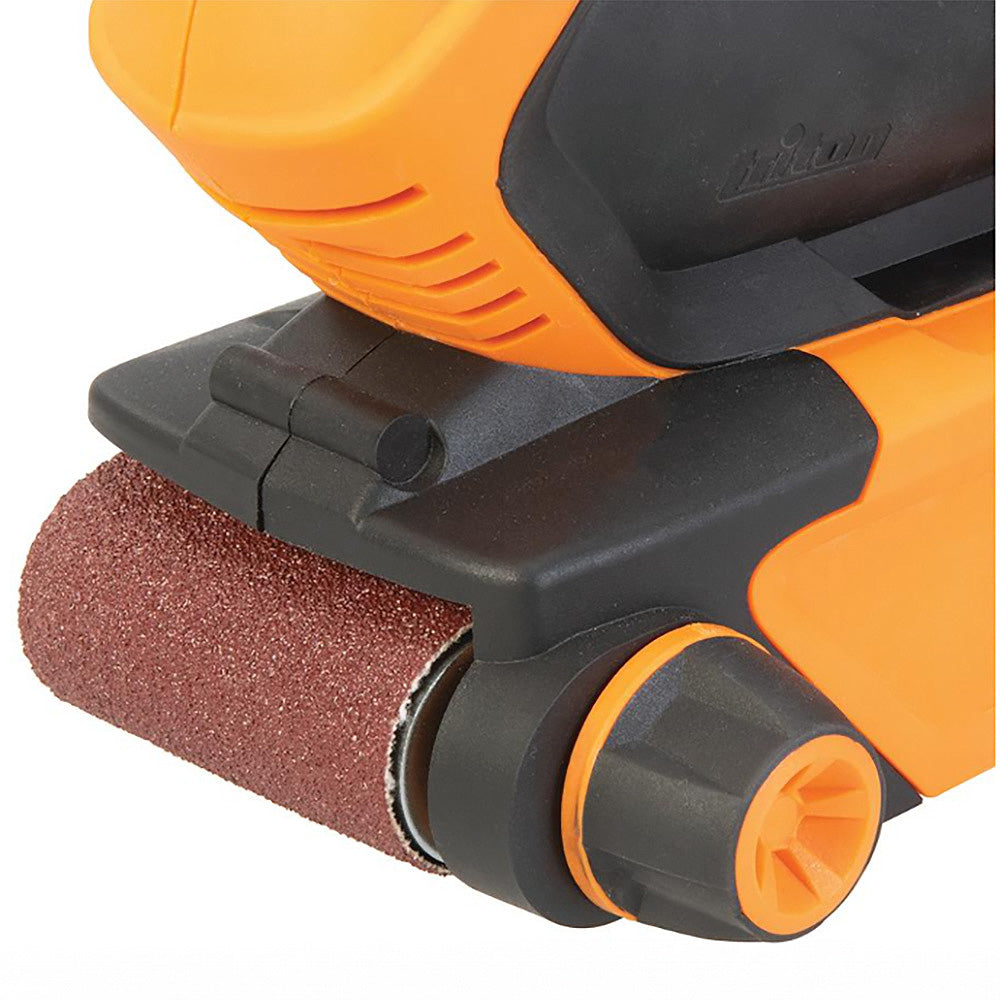 Close-up of an orange belt sander with sanding belt, woodworking tool detail.
