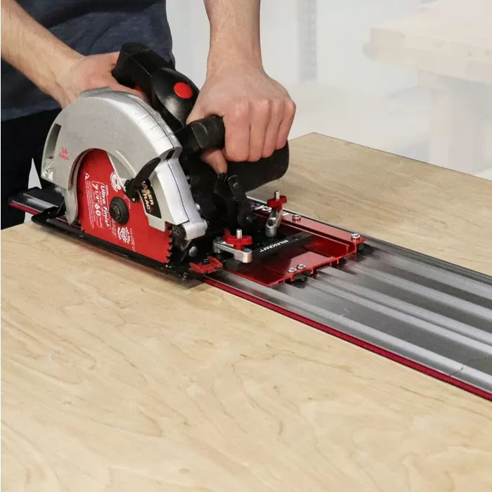 Circular saw with guide rail cutting plywood for woodworking precision