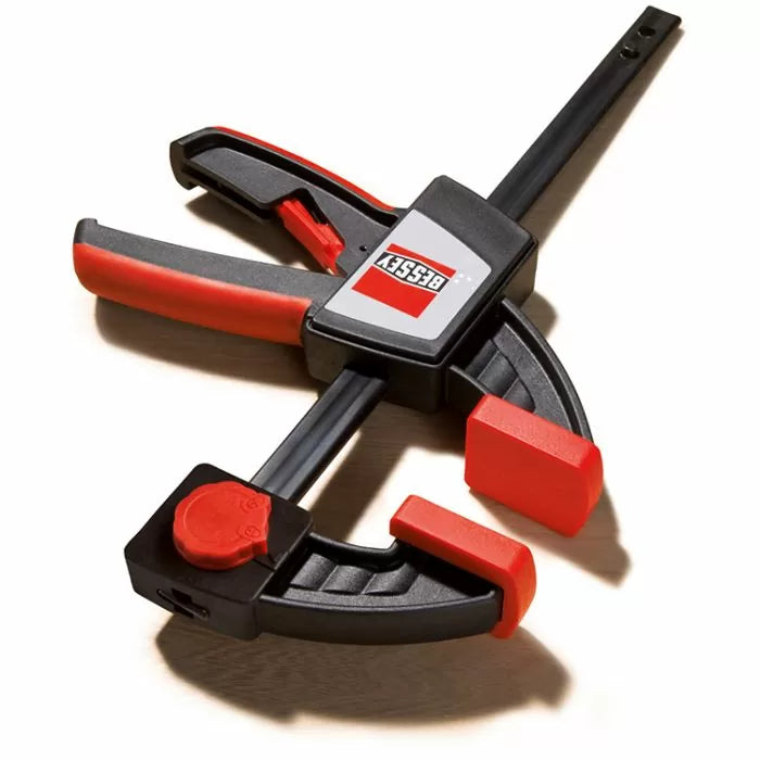 Bessey quick-release woodworking clamp with black and red ergonomic handle