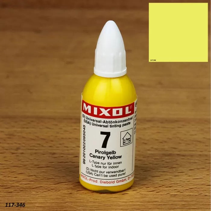 Mixol Canary Yellow universal tinting paste bottle on wood surface, color swatch in corner
