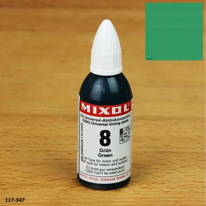 Mixol green universal tinting paste bottle on wood surface with green color sample