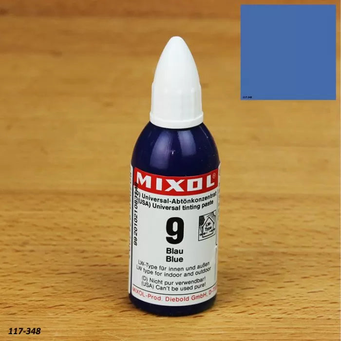 Mixol blue universal tinting paste bottle on wood surface with color sample swatch