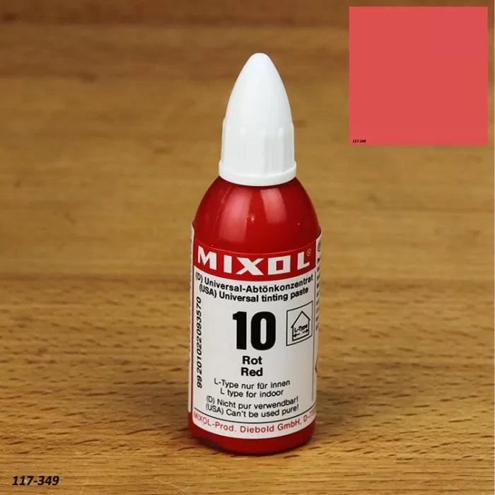 Red Mixol universal tinting paste bottle for wood finishes on a wooden surface