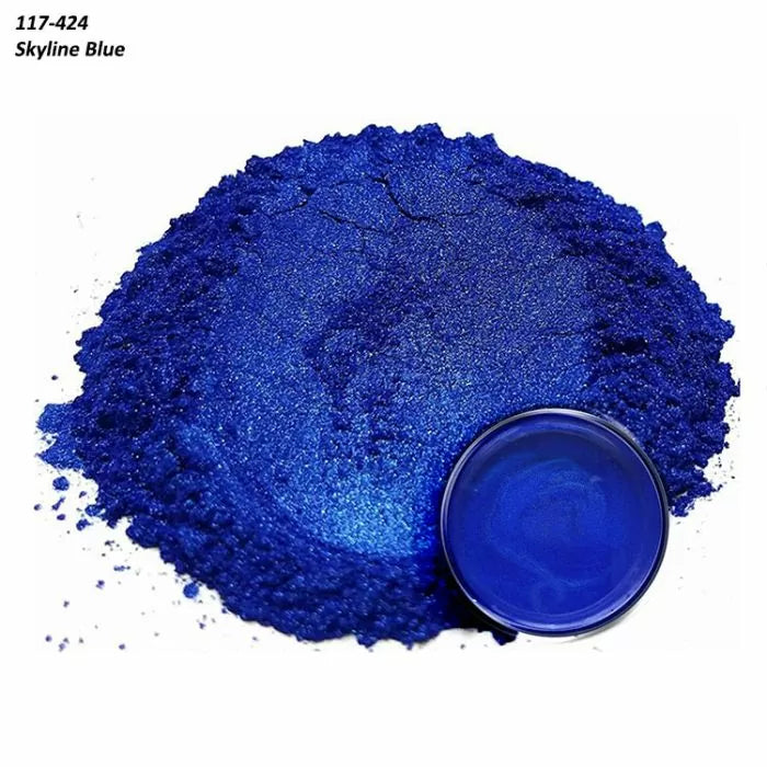 Skyline Blue metallic pigment powder with a matching blue liquid sample in a container