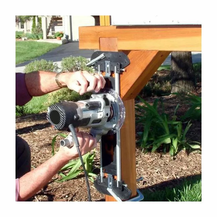 Woodworking router jig in use for cutting precise joinery on outdoor wooden post