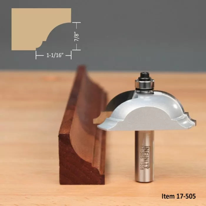 Large molding router bit with sample wood profile and dimensions on a workbench