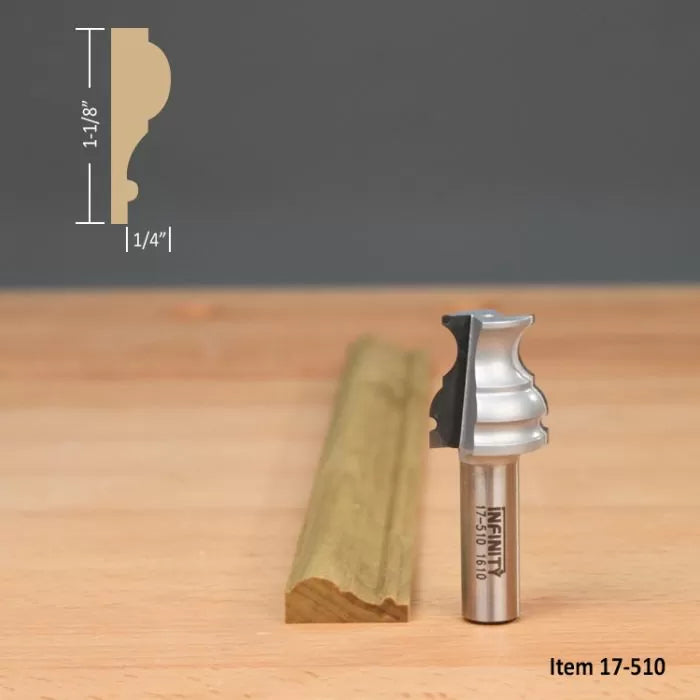 Classical router bit with cut molding profile and dimensions, woodworking tool on wood surface.